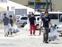 Employees clean up neighborhood.